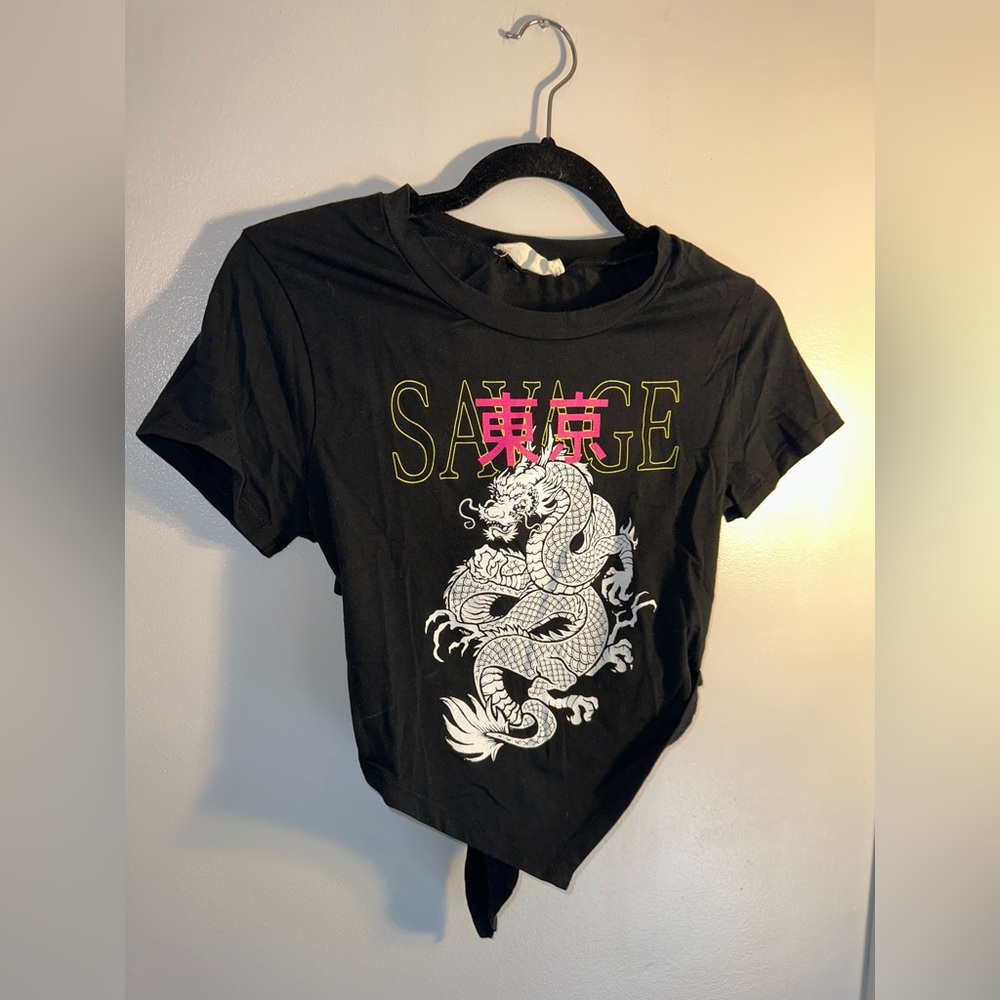 “SAVAGE” Women’s crop top and cut out back. Rarely worn, fits extra small-small.